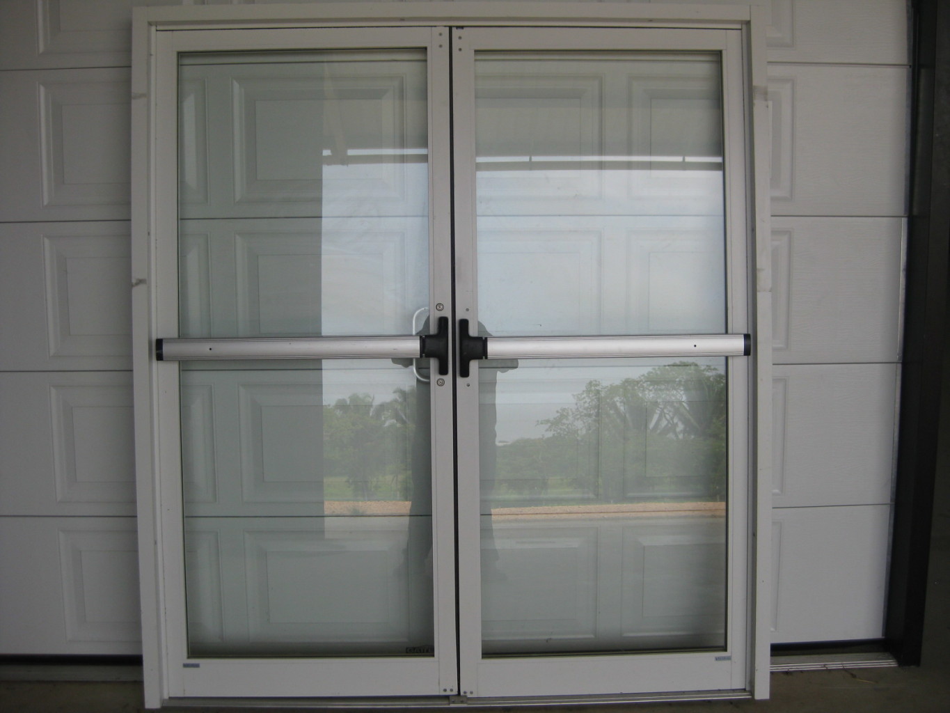 Commercial double action glass door Peters Glass Shop
